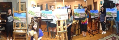 Alicia and friends with paintings