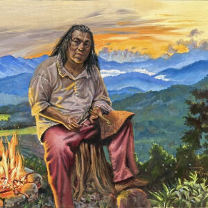 This Land is Your Land 20×24″ oil on panel, framed by the artist Everywhere I go, I am looking for inspiration. A few weeks back, we were able to stay in a home on a creek in the Great Smoky Mountains. The painting depicts a native American member of the Eastern Band of the Cherokee Nation, in western North Carolina. We had a chance to visit the Oconaluftee Indian Village, where the 18th-century Cherokee lifestyle is preserved via live tool and craft demonstrations and authentic buildings. This gentleman was creating arrows for hunting the traditional way. And on the way back from Dry Falls, I captured this beautiful vista of the Smoky mountains at dusk, combining them to create this image of the craftsman, a reminder of who this land really belongs to. The light from the fire appears as war paint on his curious face. There is no judgment but there is a knowledge in his face that his people were on this land centuries before European colonists took it and made it their own land with their superior weaponry and patriotic songs